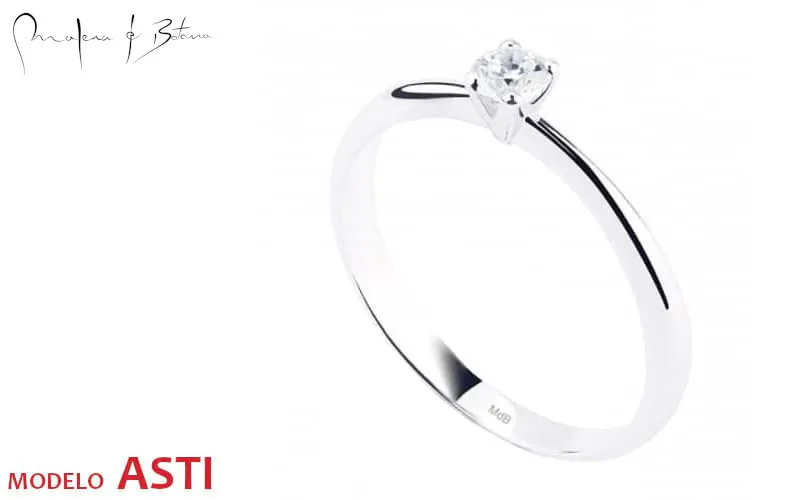 Anillo solitario minimalista en oro blanco con piedra central y banda delgada vista en ángulo