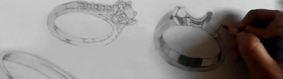 Primer plano de una mano dibujando el boceto detallado de un anillo de compromiso, mostrando el proceso creativo de diseño personalizado en joyería nupcial