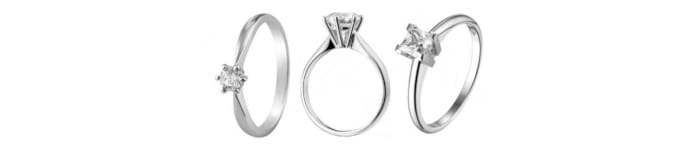 Imagen de un anillo de compromiso con montura clásica, mostrando el diseño desde tres ángulos diferentes, con una piedra central destacada.